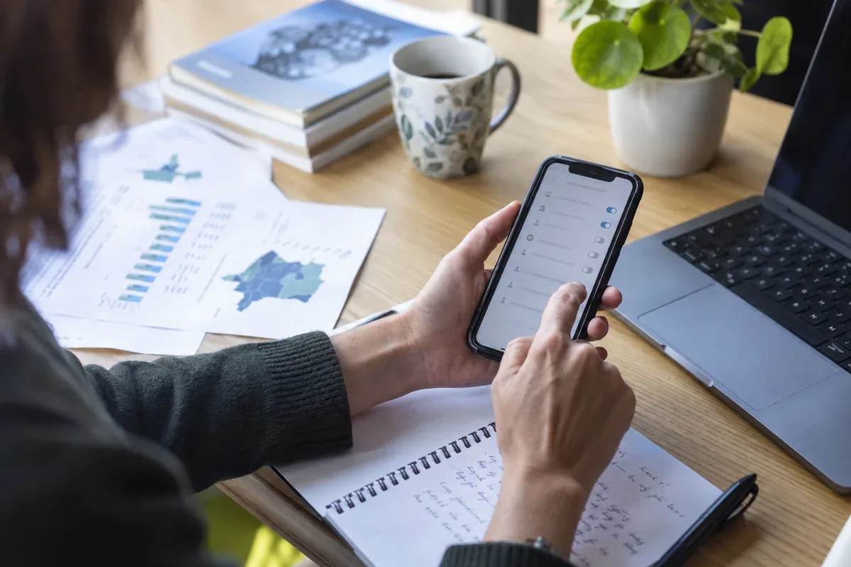 A phone and notebook for reviewing digital settings